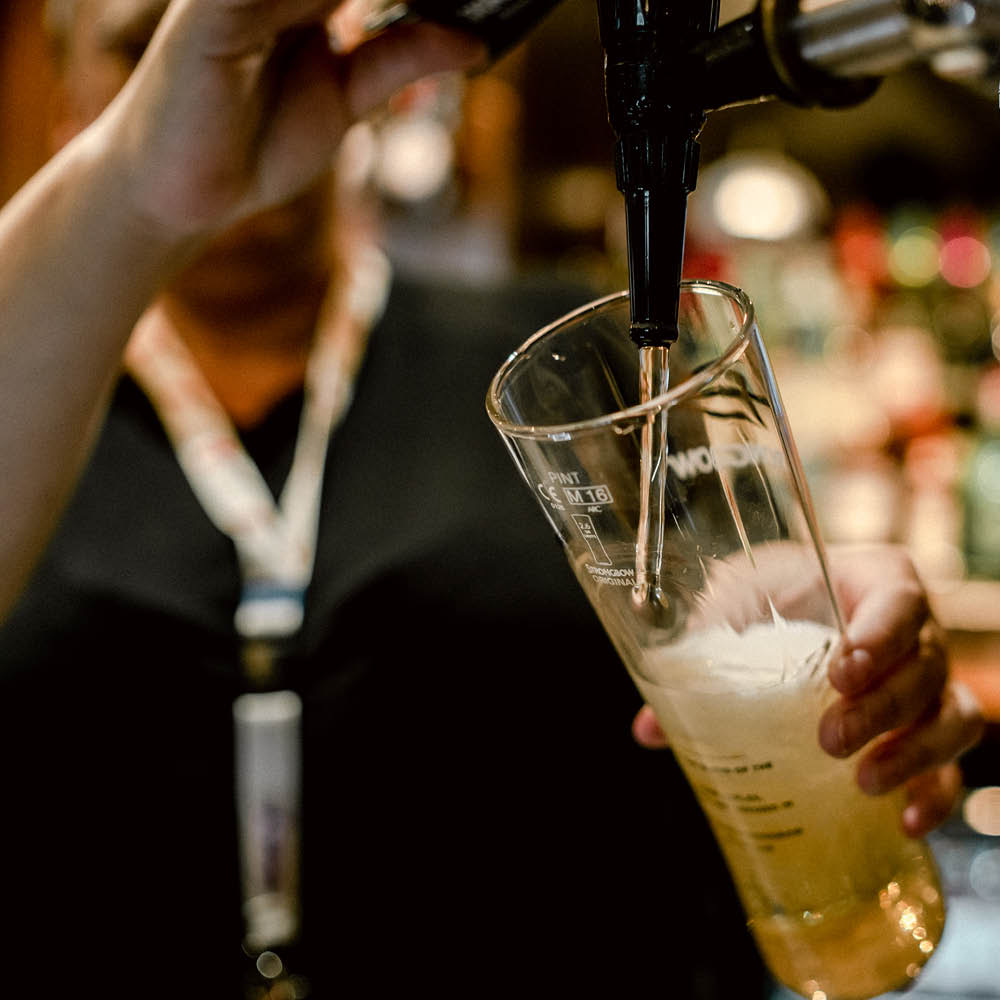 A pint being poured at the Queen's Head
